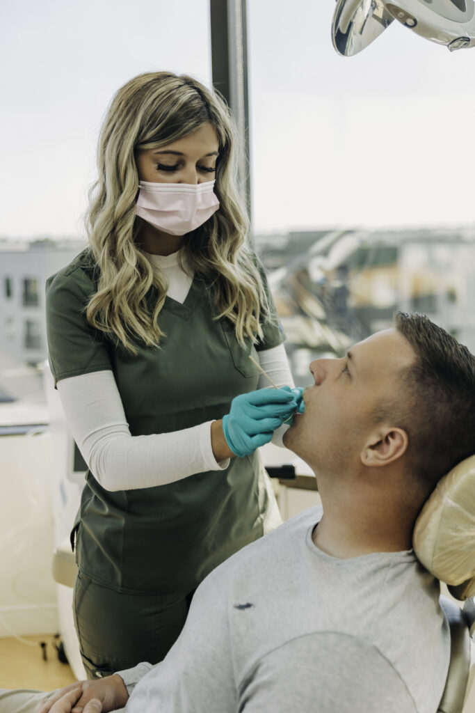 Dr. Sharon Dickerson performing minimally invasive endodontic treatment at her Denver holistic dental practice