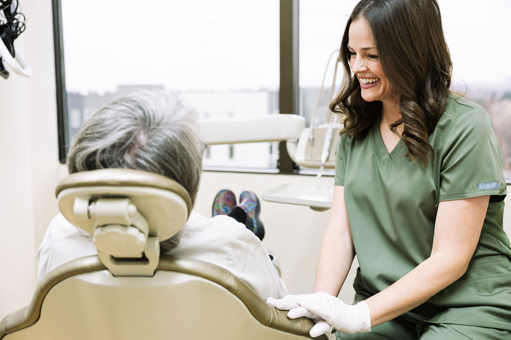 Patient relaxing in a dental chair during a gentle holistic dental cleaning in Denver
